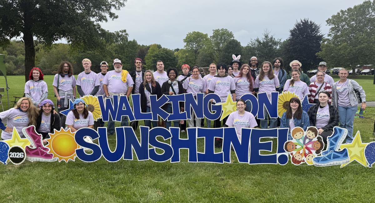 students pose after participating in the Walking on Sunshine fundraiser