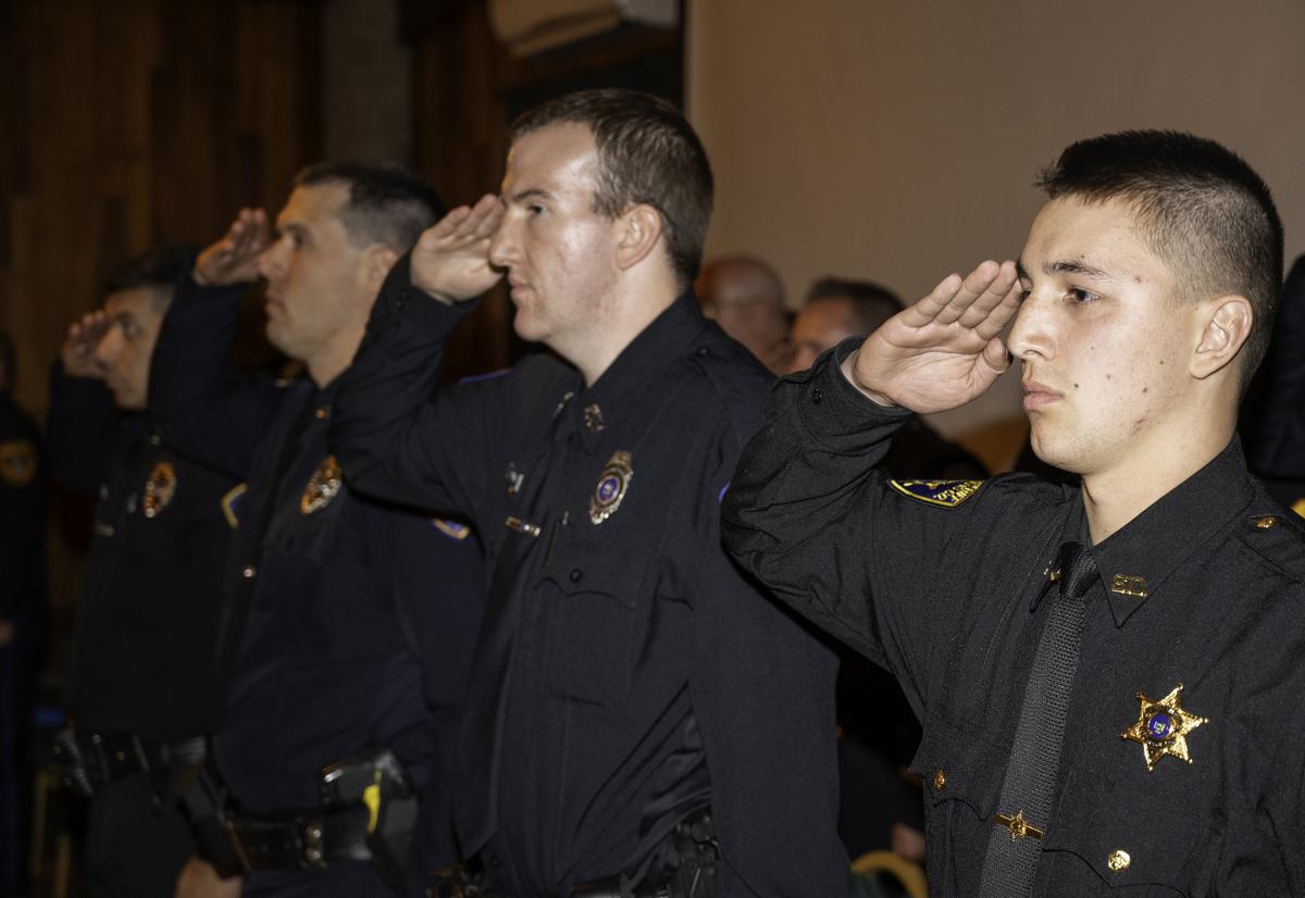 Cadets salute during a ceremony