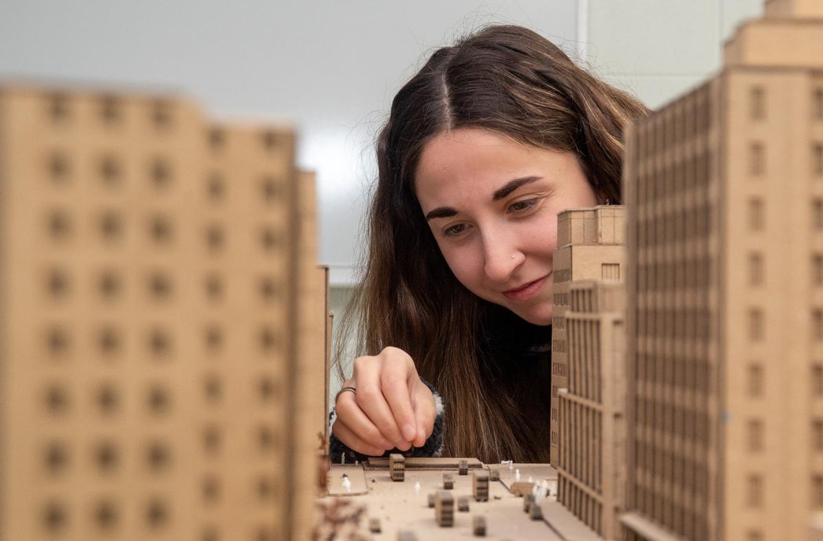 student works on an architectural model