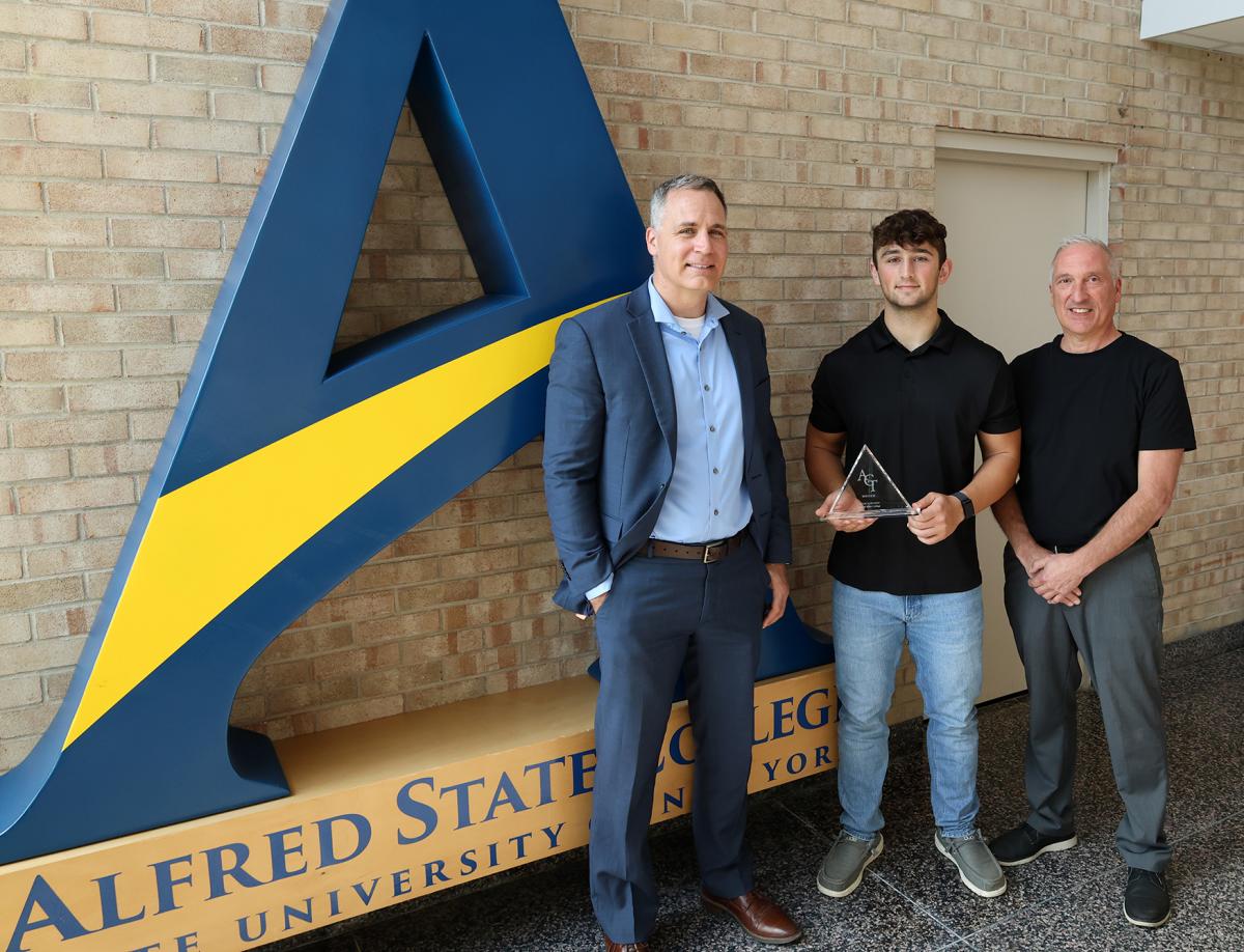 Jacob Robinson accepts an award