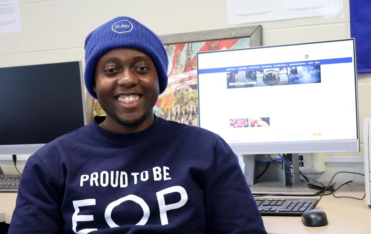 Student sits in front of a computer