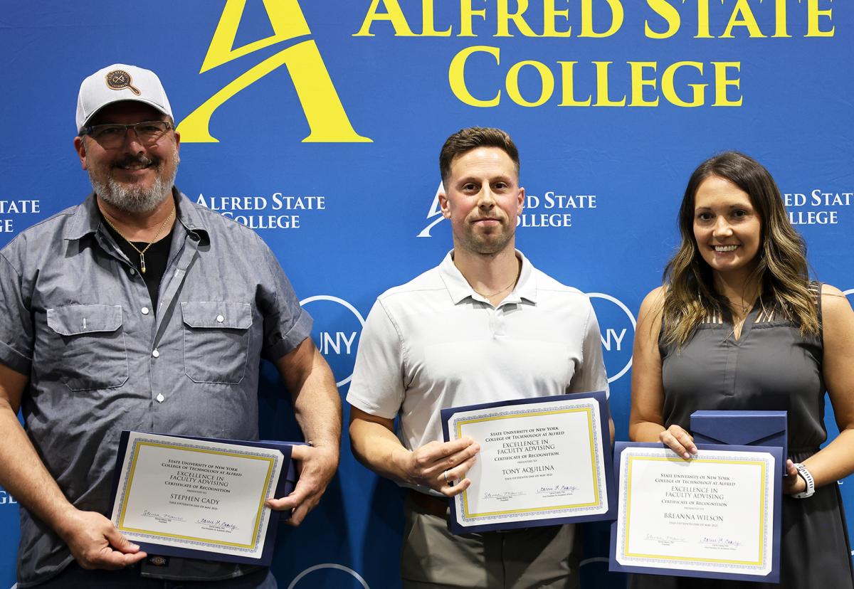 Advising award honorees display awards