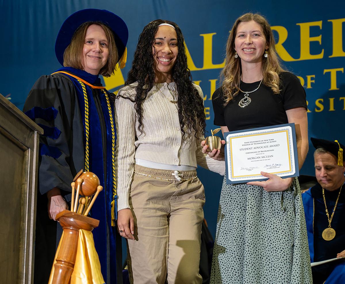 Morgan McLean accepts an award