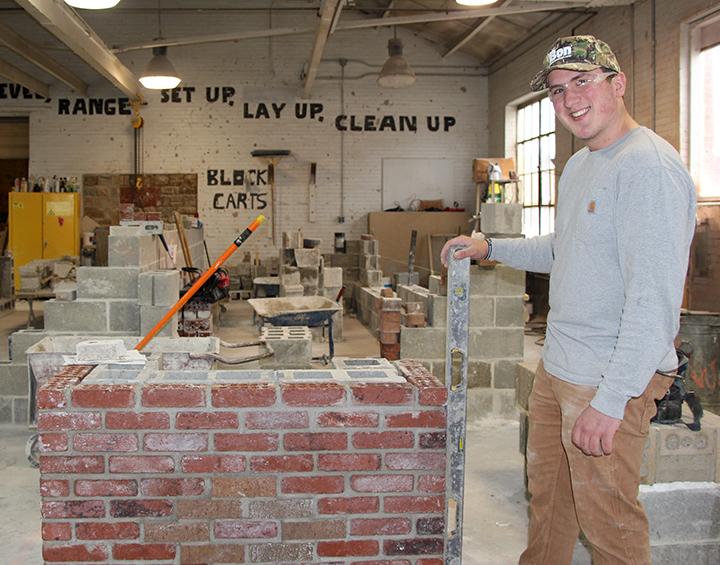 A masonry student works on a project at the School of Applied Technology. Masonry is one of several academic programs in the school ranked highly by US News & World Report.