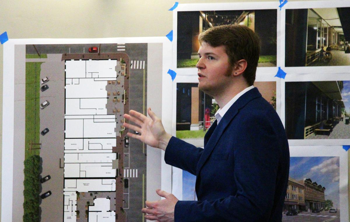 An architecture student presents his project on the redesigning of the Village of Alfred downtown business area.
