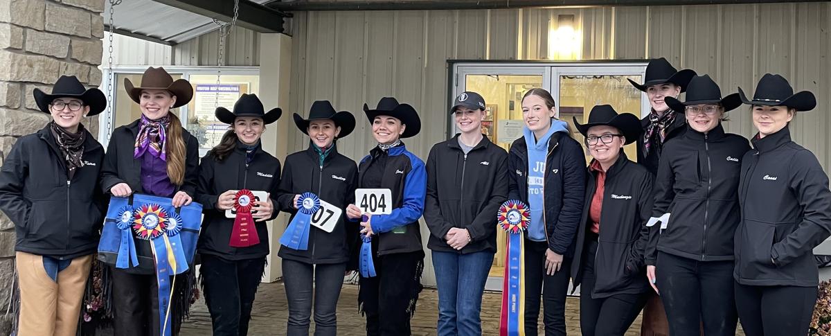 Alfred State riders display their awards from their season opening event.