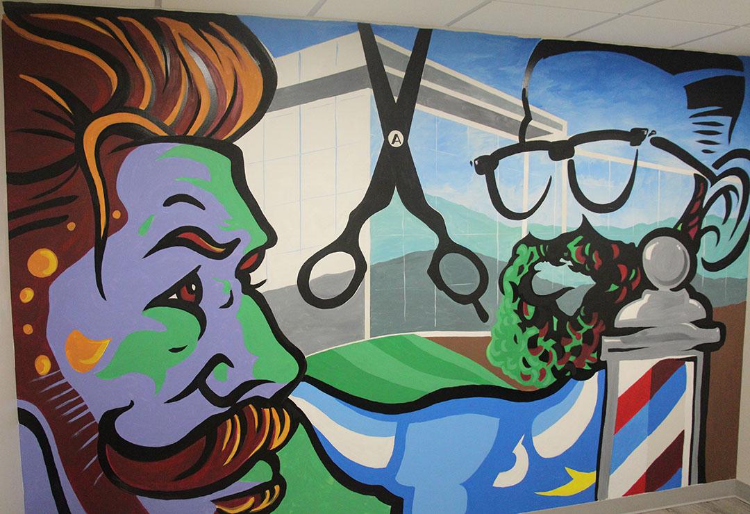 ART at ASC includes a new mural in the barber shop and styling space at Pioneer Center.