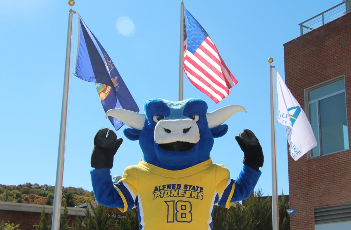 Alfred State’s mascot Big Blue is ready to show the chancellor how the Pioneers are “strong as an ox” when Chancellor King visits Alfred.