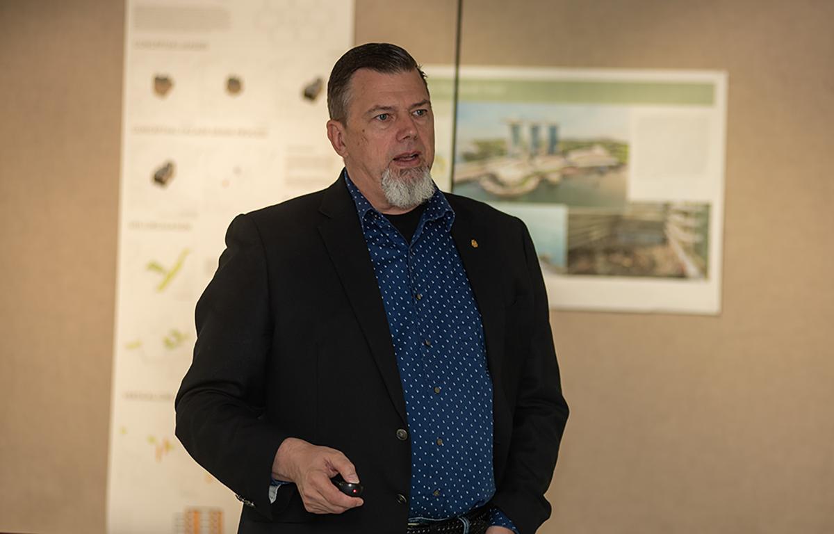 Professor Dean speaks in his class