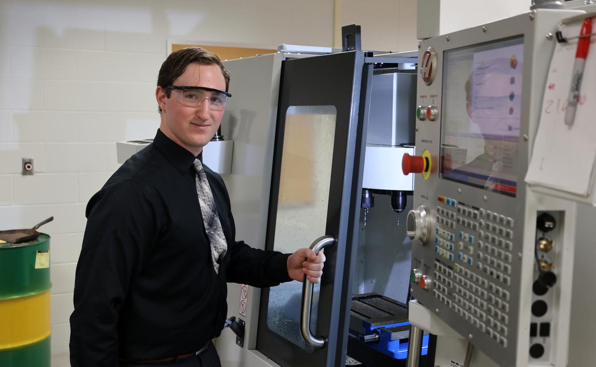 student works on a machine