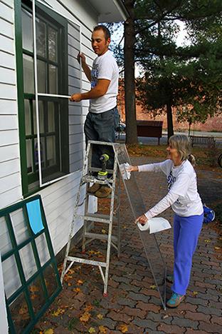 CSCA Day- Alfred State student Jake Paquette and staff member Kathy Bayus volunteer at Alfred Box of Books Library