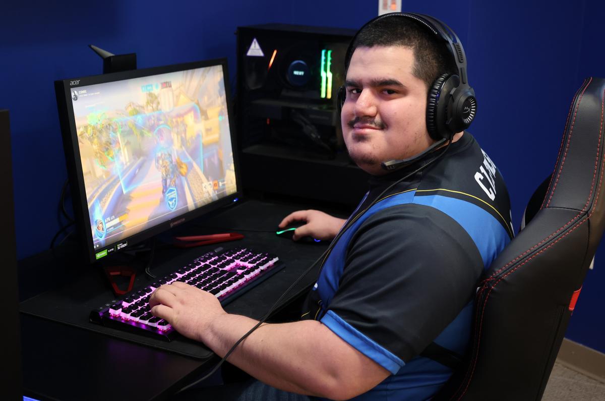 student playing video games at a computer