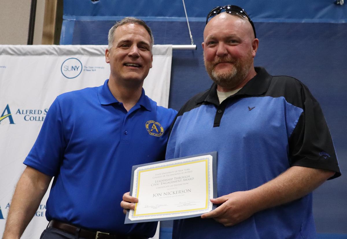 Jon Nickerson receives award from Dr. Mauro