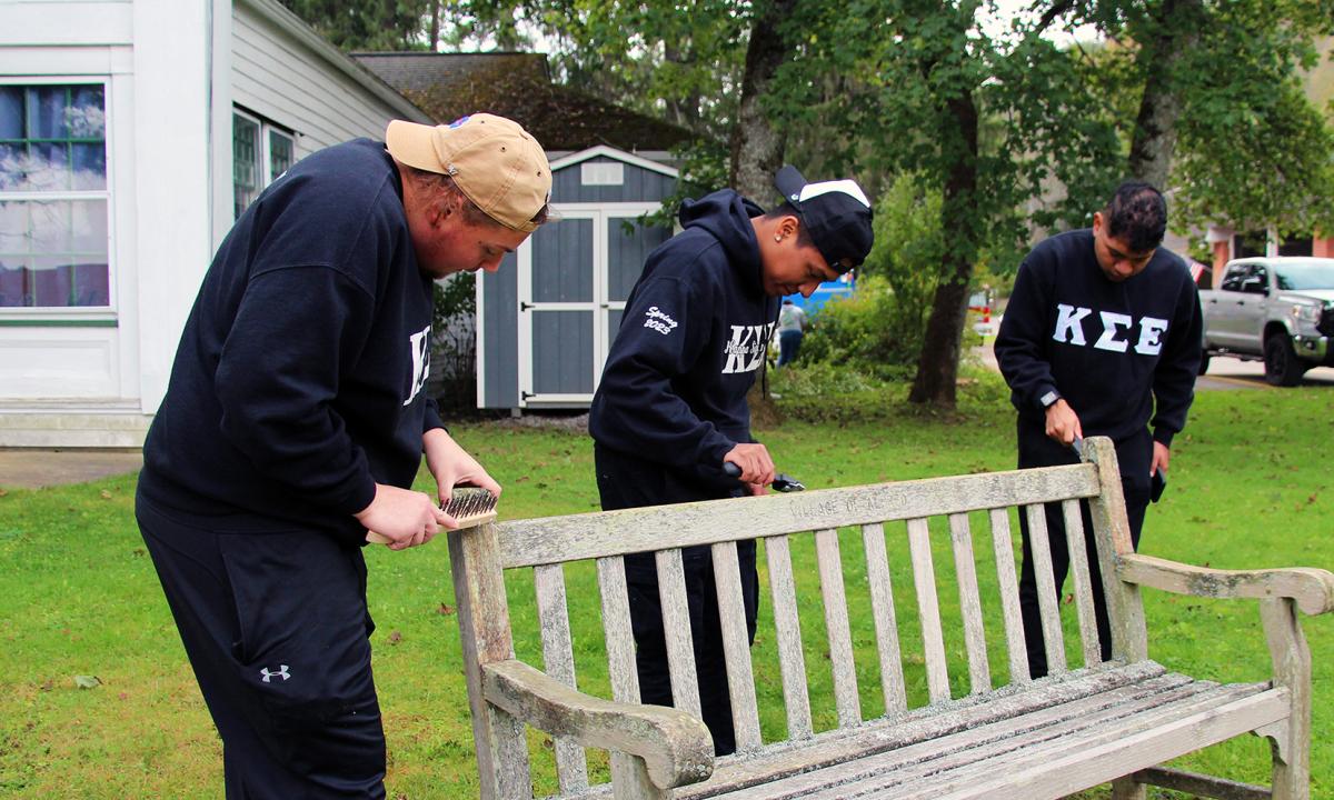 Students repair a bench