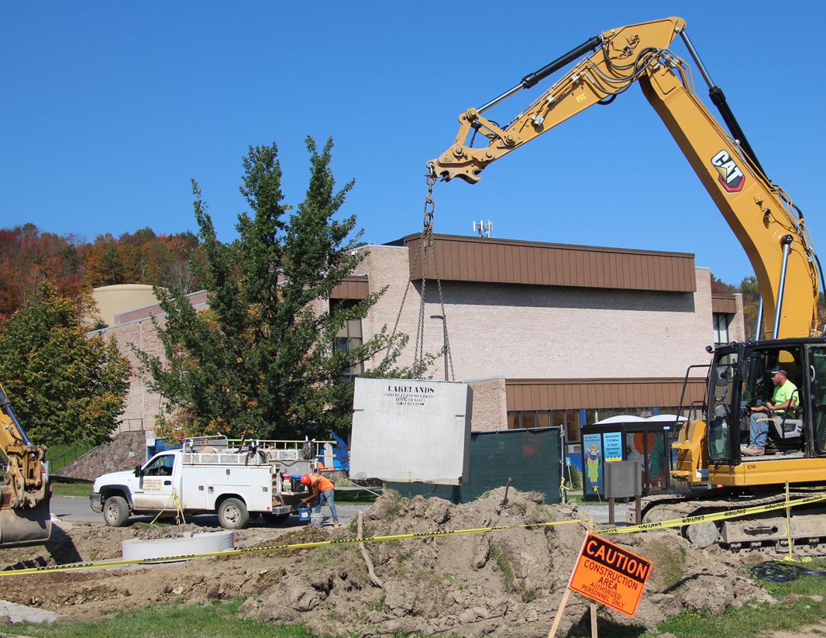 Cranes work outside of the Orvis Activities Center on the infrastructure project. Alfred State has $100 millions dollars of improvement underway. 