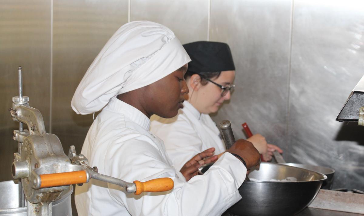 Culinary Arts students work in the kitchen.