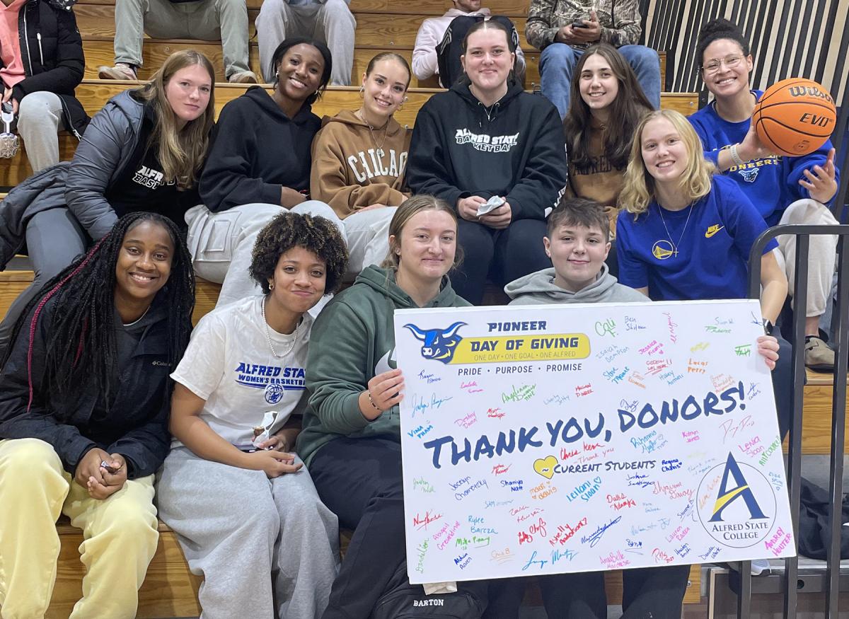 students with a thank you card