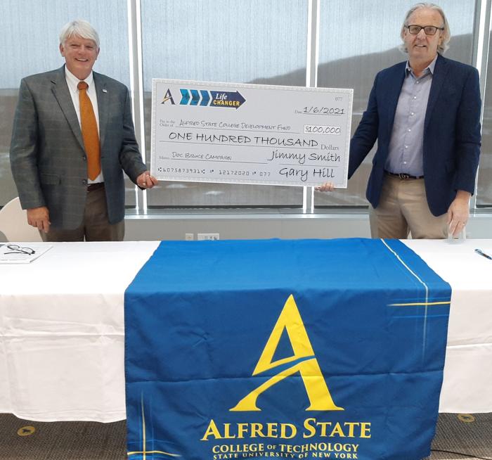 two men holding a check