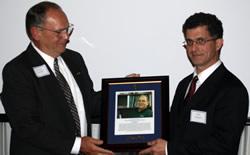 Doug Barber receives plaque from Ron Rosati