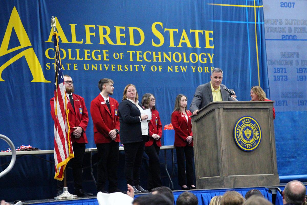 Alfred State President Dr. Steven Mauro speaks with the students that competed during the 34th annual Skills USA competition during the awards ceremony.