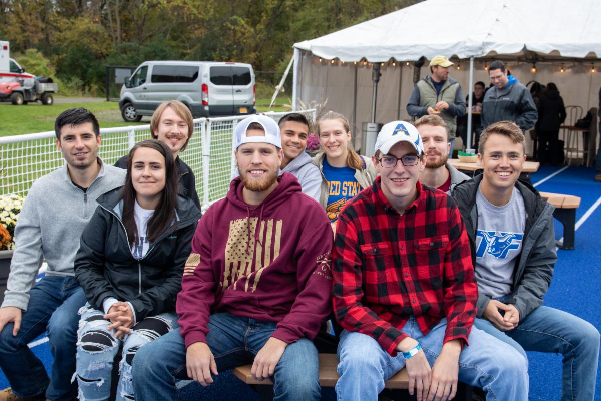 Alfred State graduates enjoy the End Zone Party at a past Homecoming/Family Weekend.