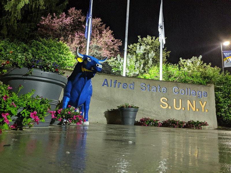 Front entrance of Alfred State College at night