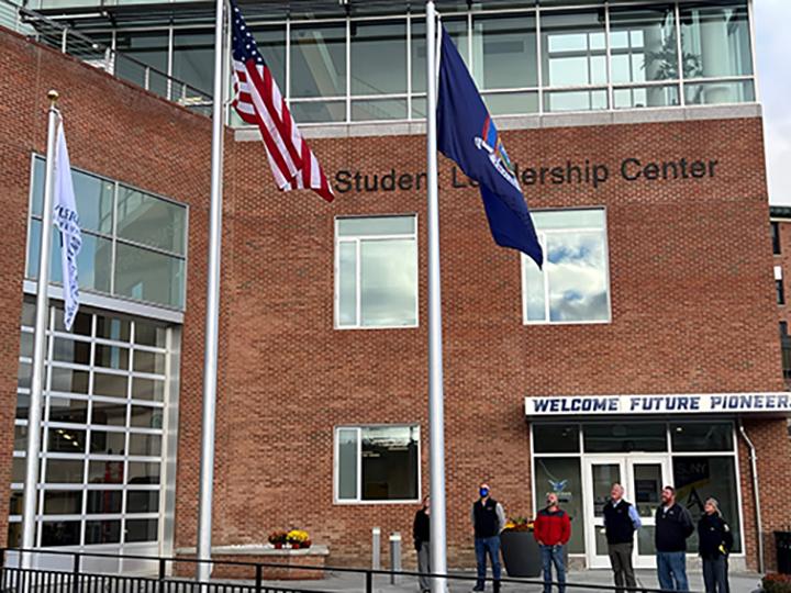 Flags at the front entrance to the Student Leadership Center 