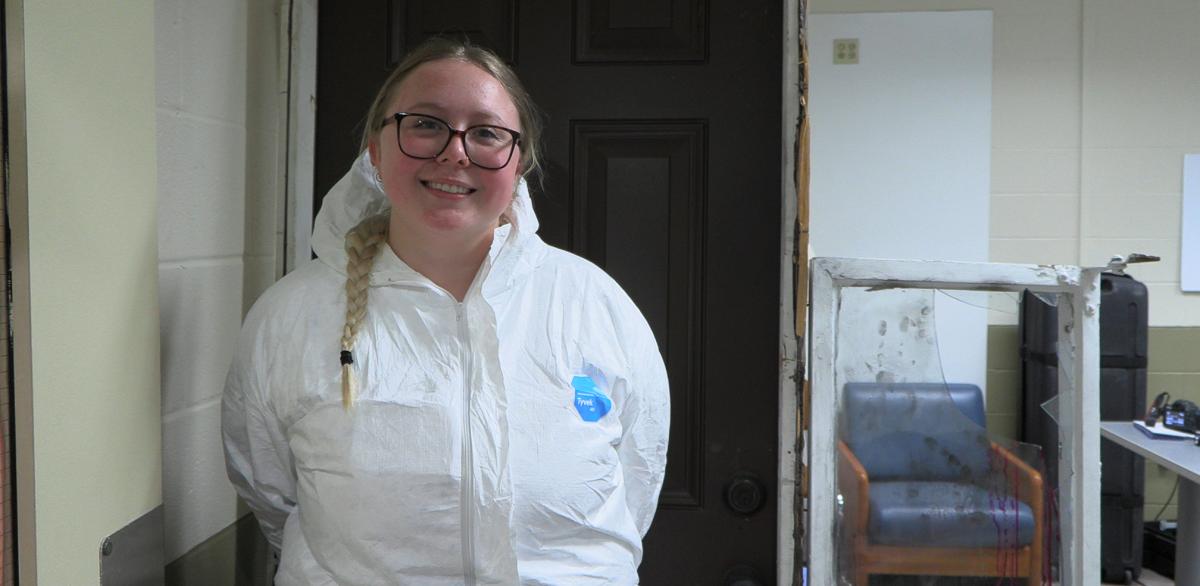 student in a crime lab