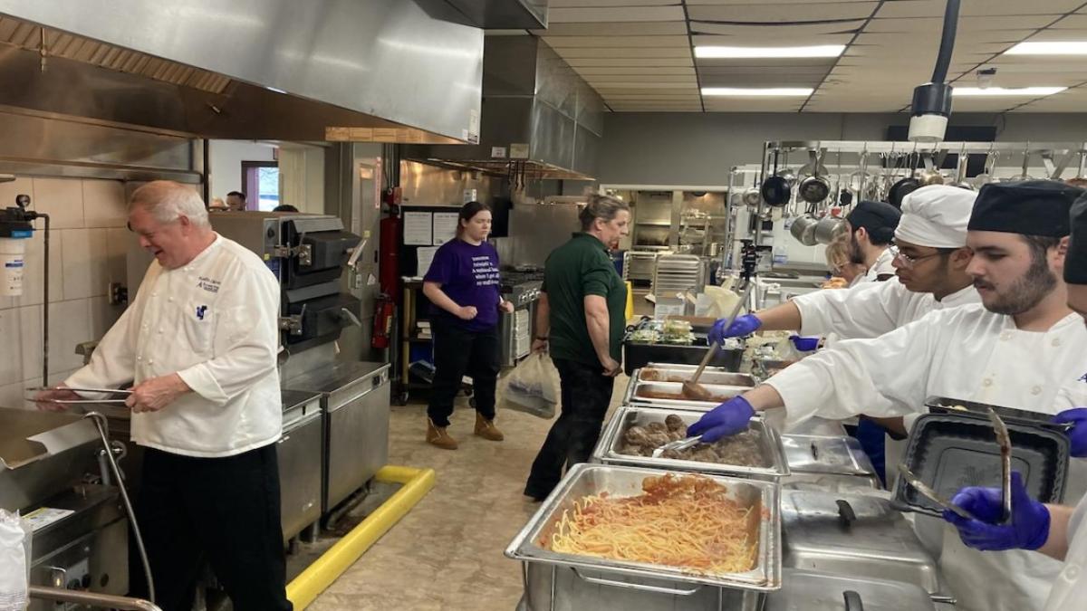Preparing takeout spaghetti dinners