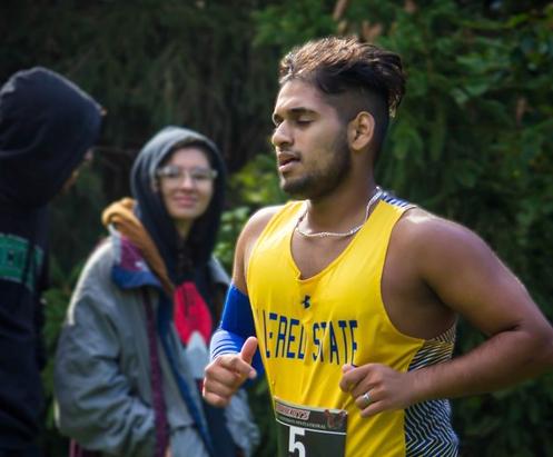 Jeff Jijy runs in a cross country meet