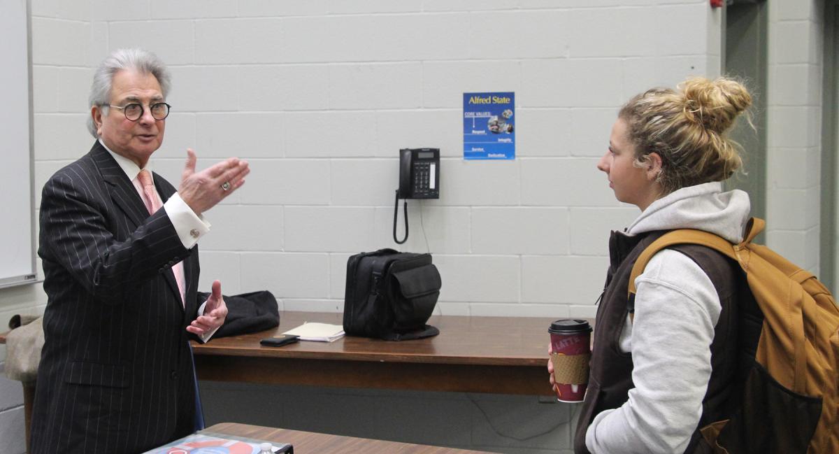 John Ninfo speaks with Emma Bower, an Agriculture Entrepreneurship major, following one of the three presentations he made at Alfred State about student finances.