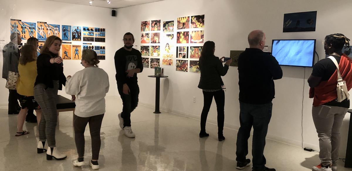 Visitors of the Bret Llewellyn Gallery enjoy projects by Alfred State Digital Media and Animation students.