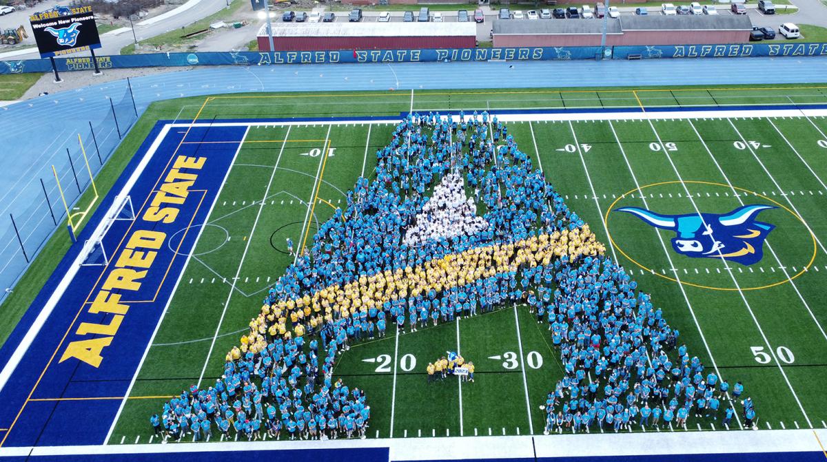 Alfred State students along with faculty and staff form their first A.