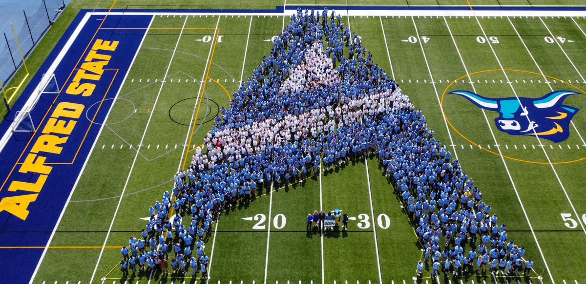 Student make an A on the football field