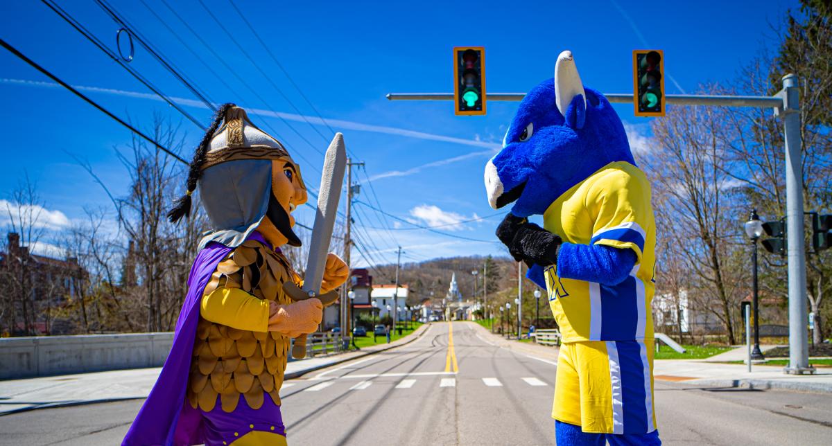 Mascots pose under the stoplight