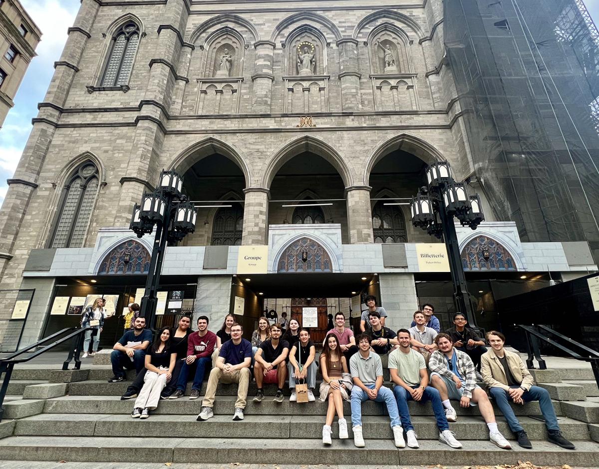 Alfred State architecture students sit in front of Notre-Dame Basilica in Montreal