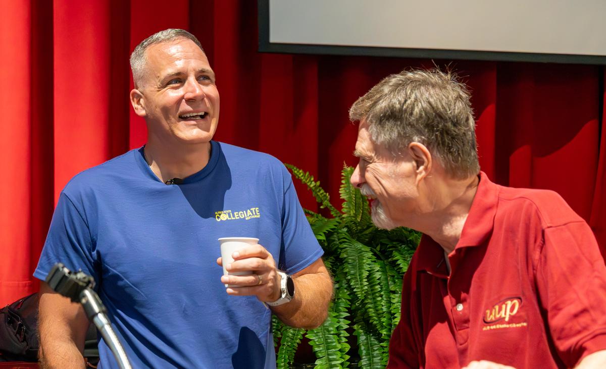 Dr. Mauro speaks with a faculty member