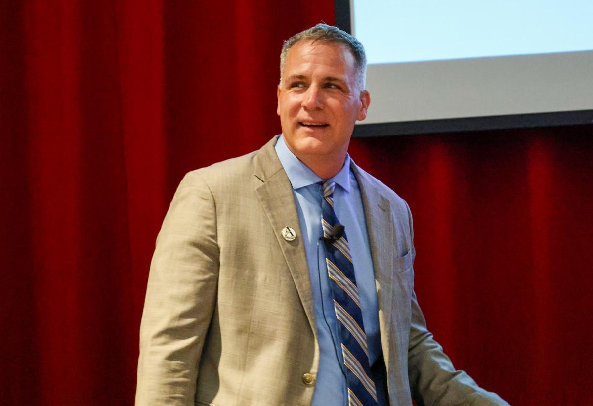 Dr. Mauro speaks in front of an audience