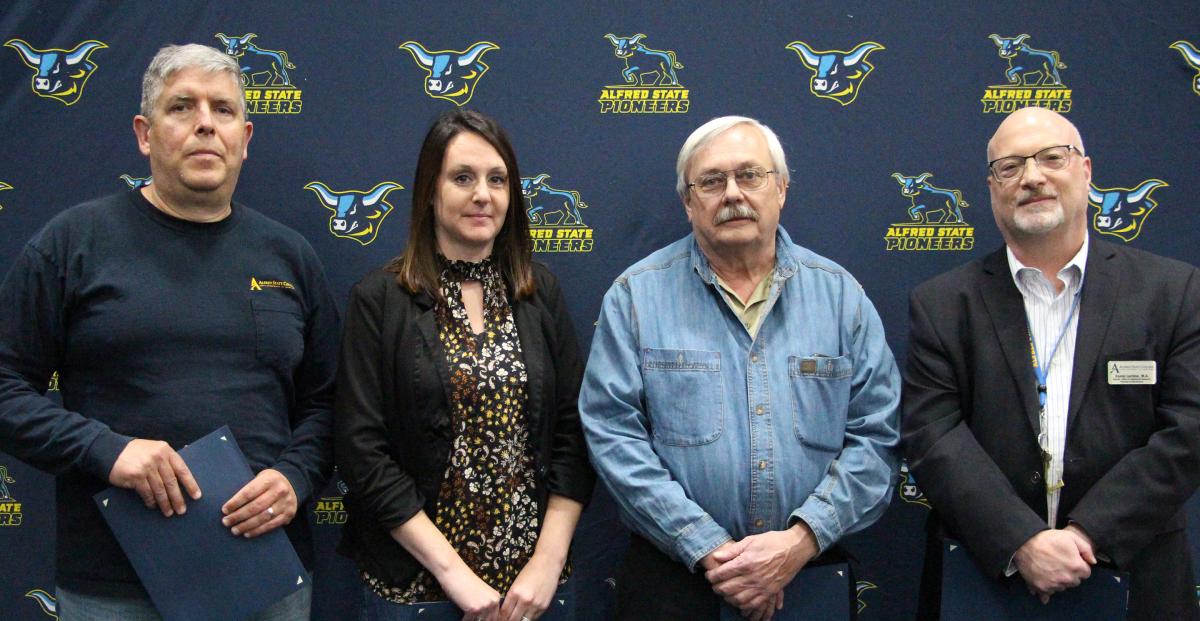 Alfred State awarded the Pioneer Award to Daniel Foster,  Sandy Burdick, Timothy Dickerson, and Dan Jardine.