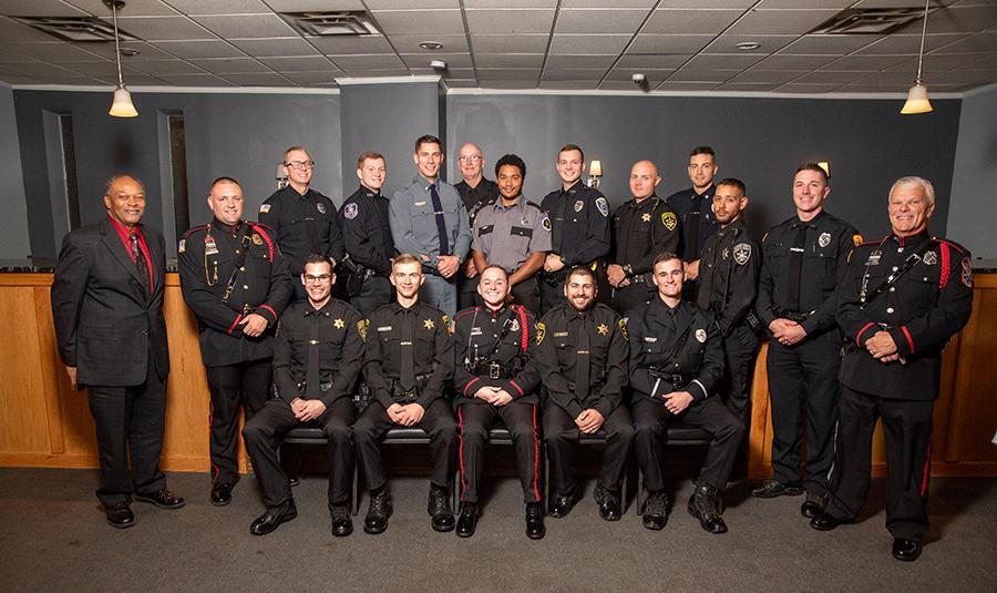 The Alfred State Police Academy pictured along with the Academy administration at the graduation ceremonies for the 2022 class.