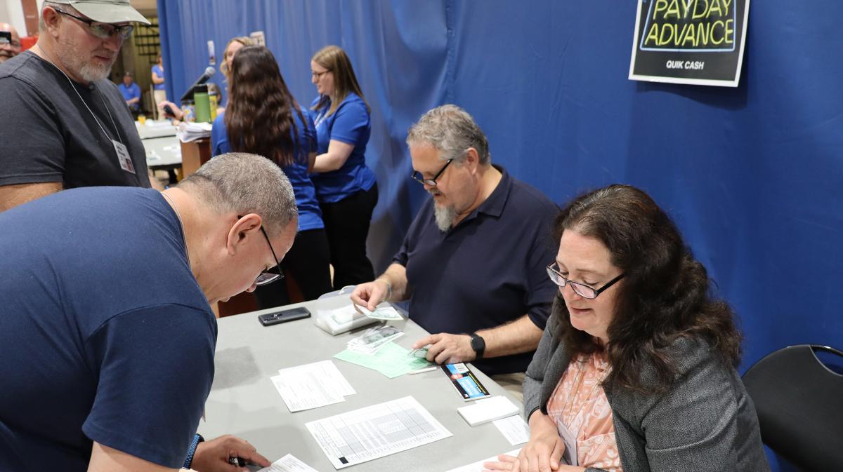 Faculty and staff participate in a poverty simulation