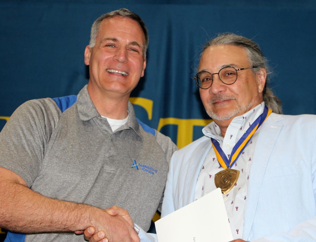 Alfred State President Dr. Steven Mauro with Chancellor’s Award winner David Carli.