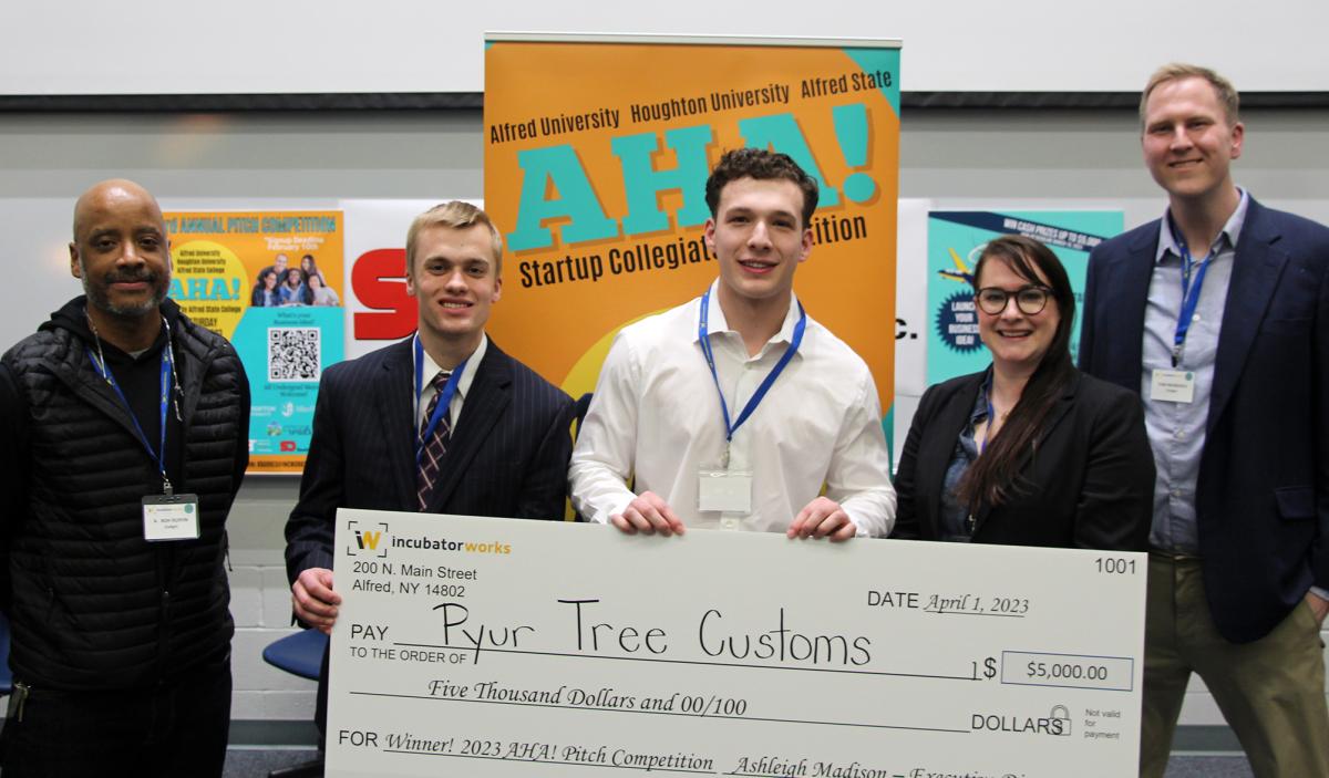 Pyur Tree Customs poses with the judges and the prize money.