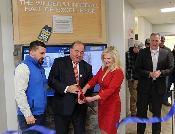 J. Joseph Wilder and his wife Laura Linneball cut the ribbon at the Hall of Excellence located in the Workforce Development Center on the Wellsville campus. Joining them are Director of Development Jason Sciotti (far left) and ASC President Dr. Steven Mau