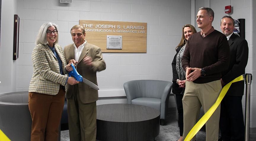 Joseph Laraiso cuts the ribbon for the new Construction & Geomatics Lab in the Engineering Building.