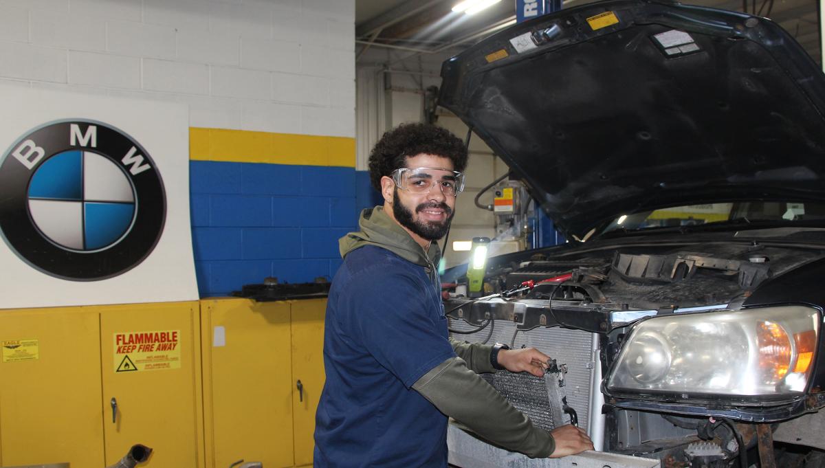 Benjamin Rivera works on a car in the automotive shop
