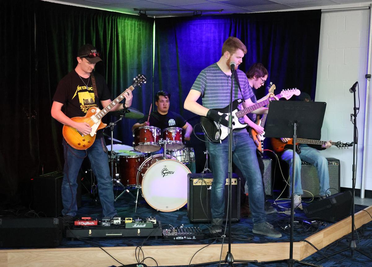 Students practice in the new Rock Band room
