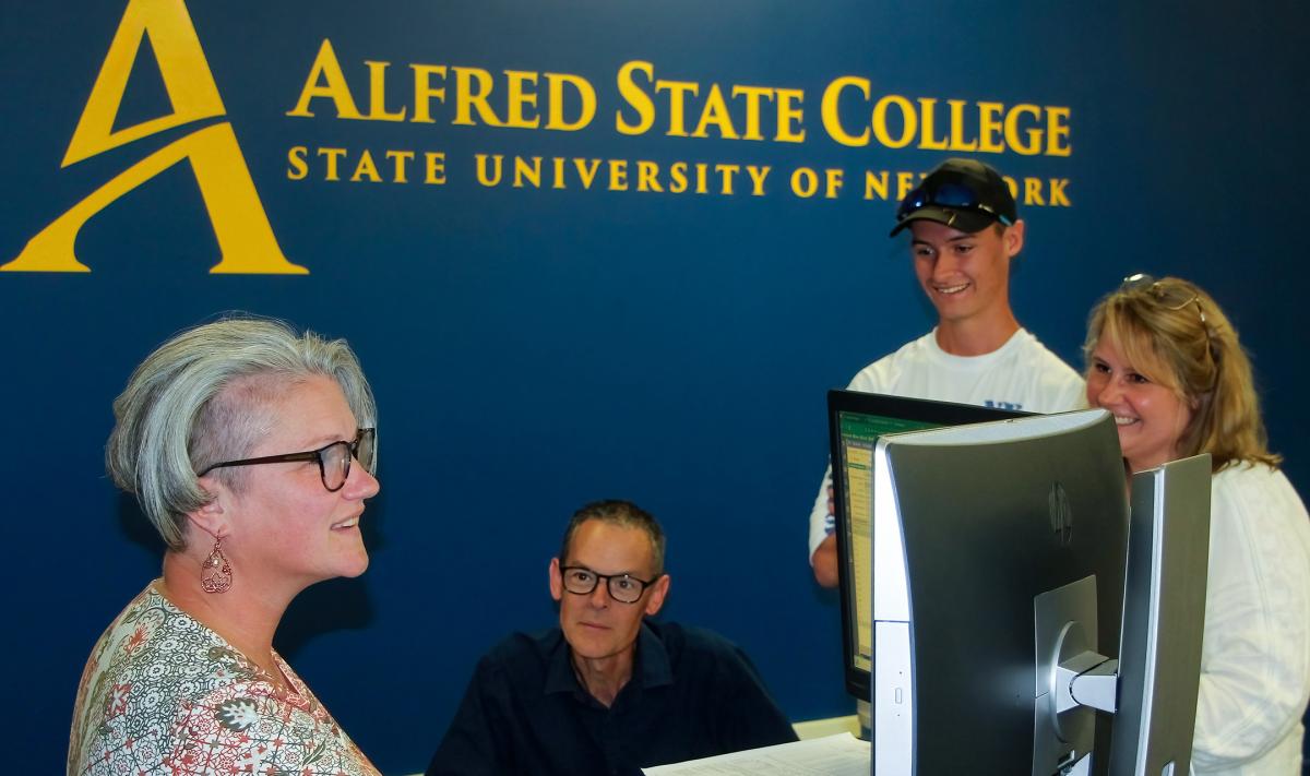 A family meets with an Alfred State financial aid representative.