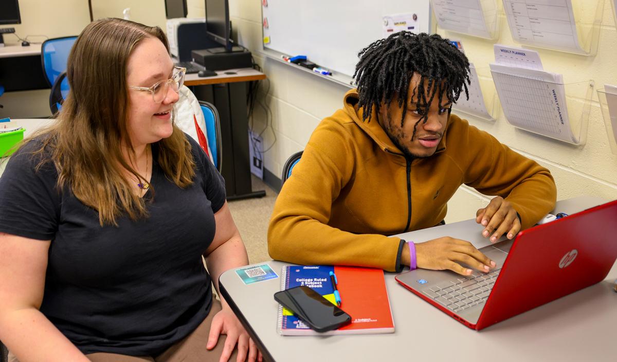 Tutor working with a student on science homework