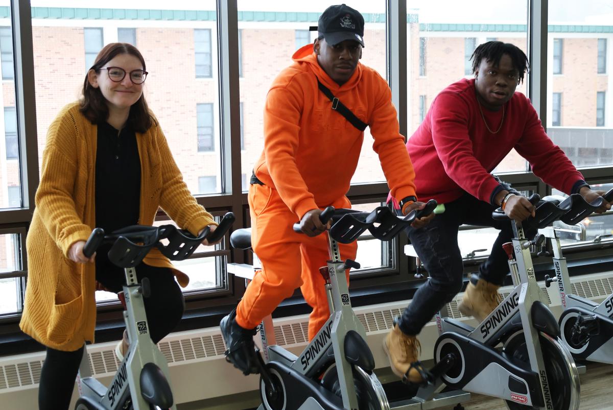 People riding spin bikes